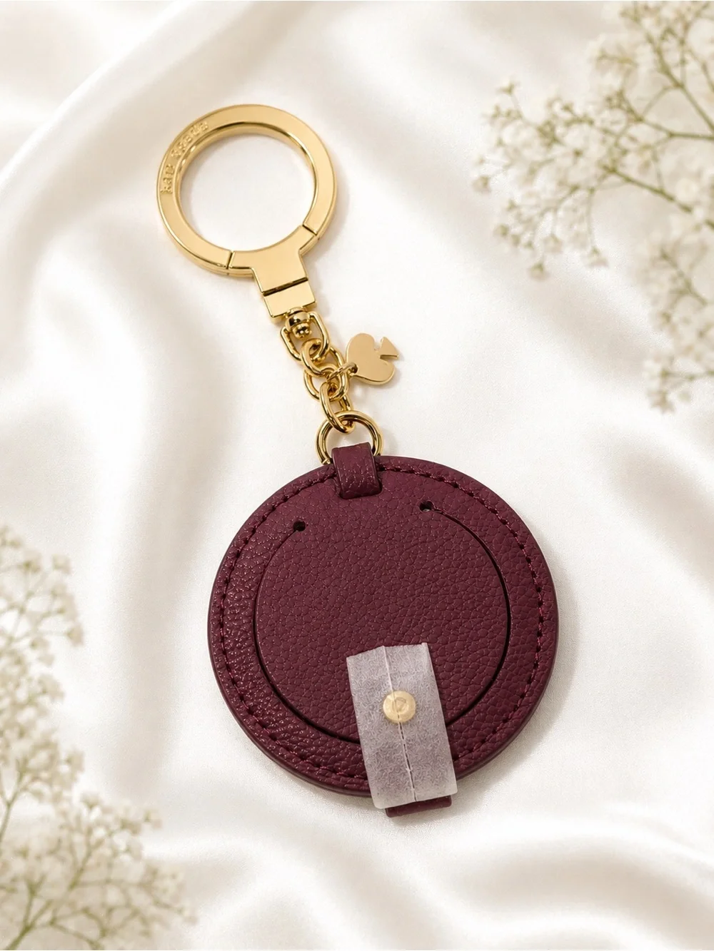 kate spade burgundy leather round keychain with gold hardware